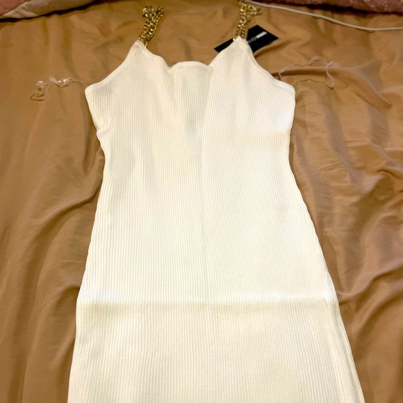 I am selling this white dress with gold chain straps. - Picture 1 of 1